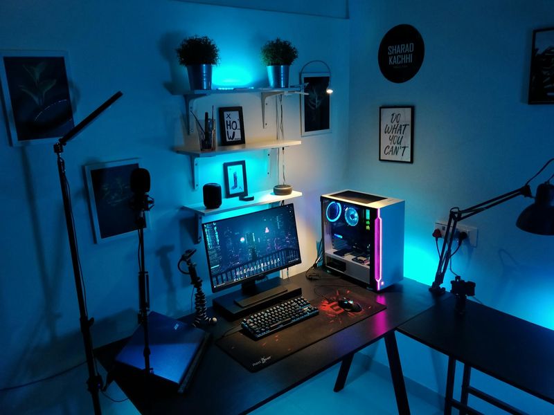 Organized workspace with soft blue lighting and modern accessories